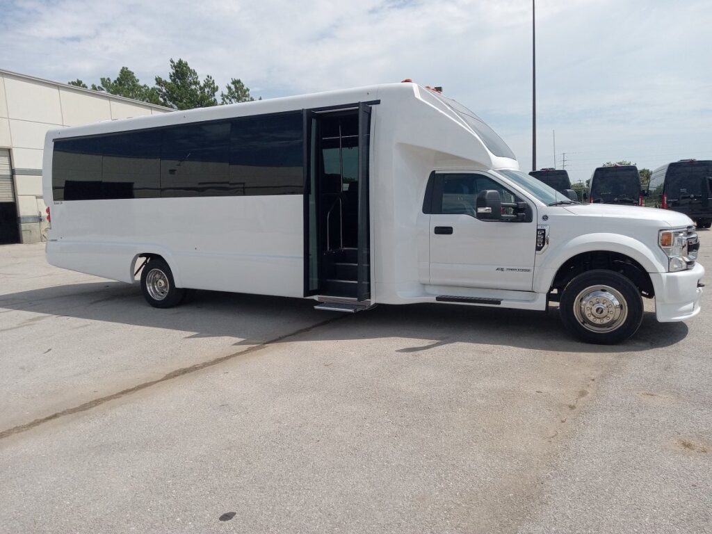 a white 24 passenger mini bus