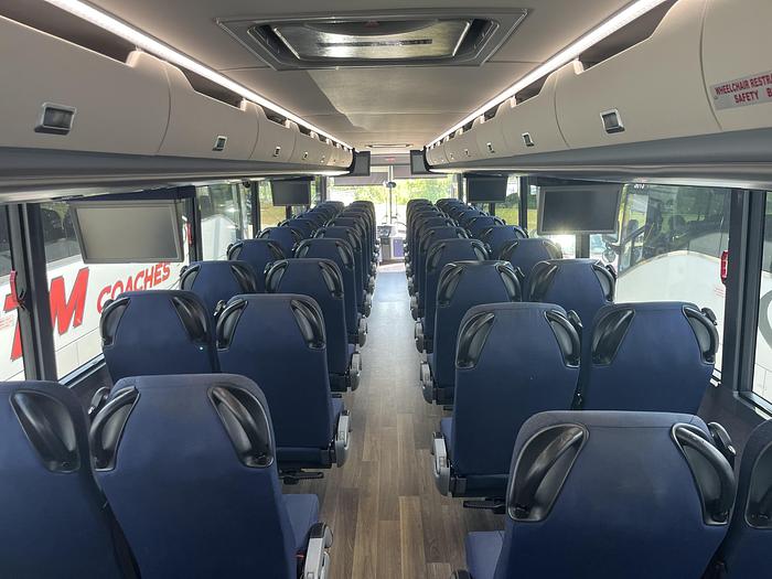 the interior of a charter bus
