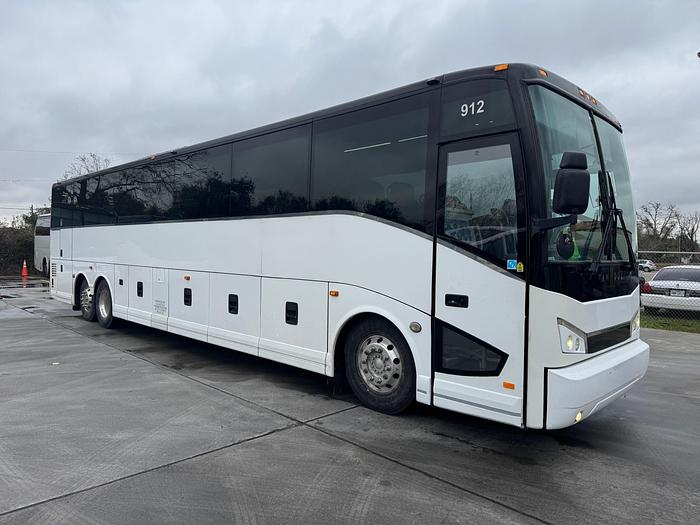 a white 56 passenger charter bus