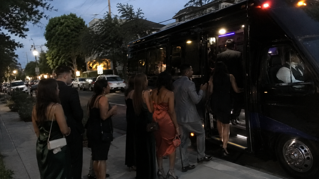Wedding guests boarding a minibus shuttle outside a Los Angeles venue