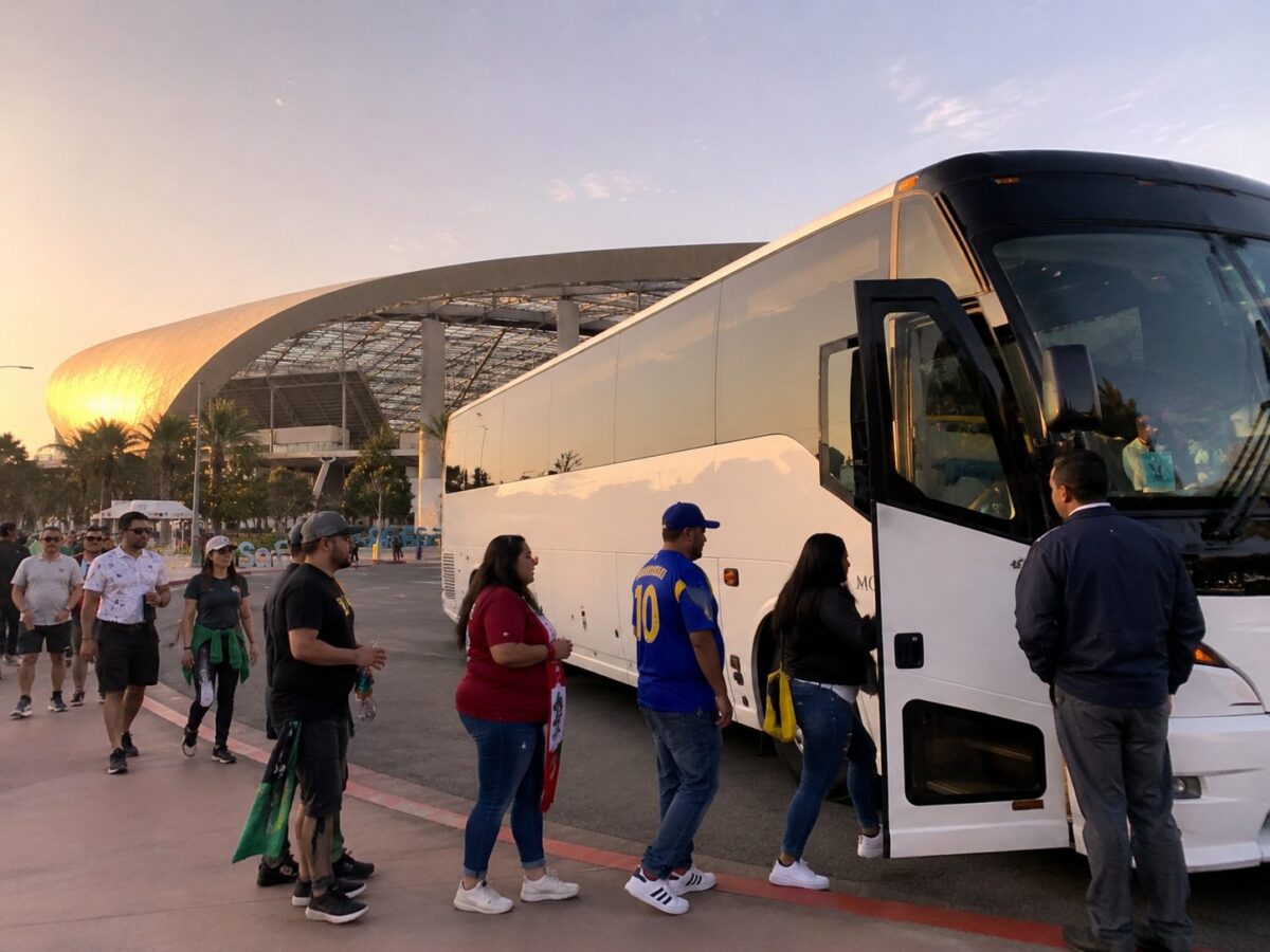 White charter bus parked outside SoFi Stadium in Inglewood at sunset, group of fans boarding for World Cup 2026 group transportation Los Angeles