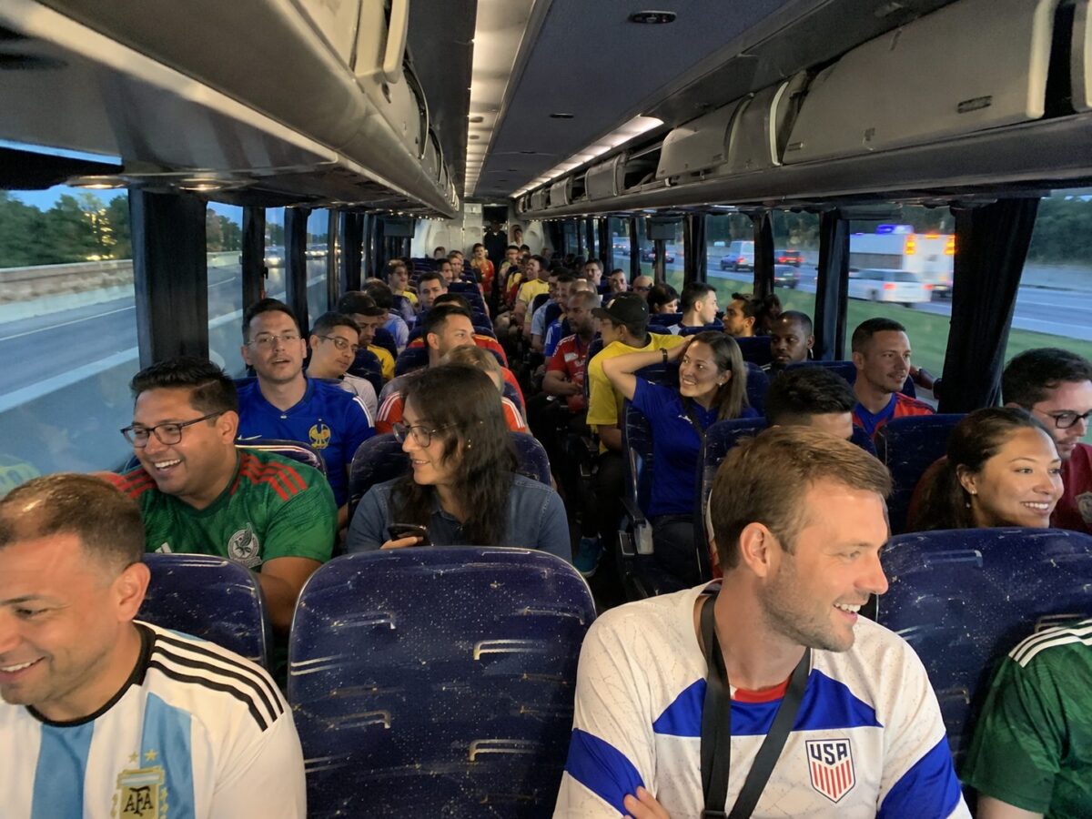 Crowd of soccer fans approaching Levi's Stadium in Santa Clara for a FIFA World Cup 2026 match, FIFA 26 San Francisco Bay Area banners on venue exterior