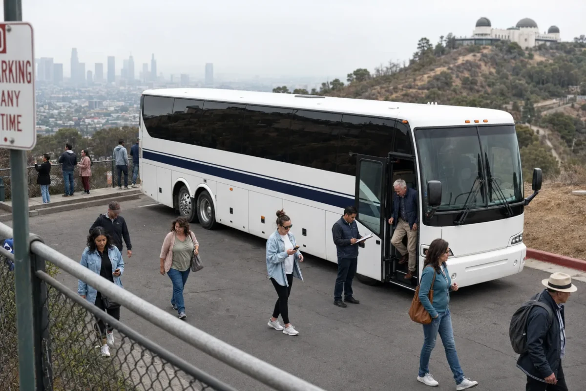 Tour group disembarking a charter bus at a Griffith Observatory overlook in Los Angeles